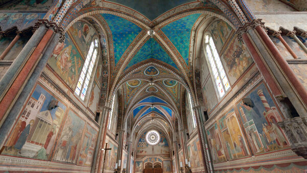 The colorfully frescoed interior of the Basilica of St. Francis, Assisi, Italy