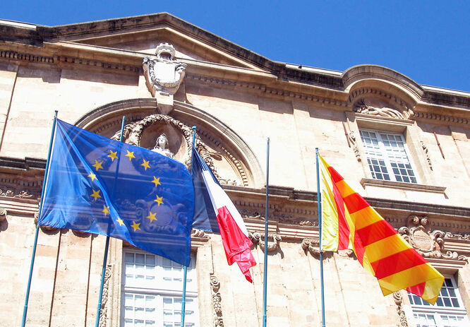 Hôtel de Ville flying flags of Europe, France, and Provence; Aix-en-Provence, France