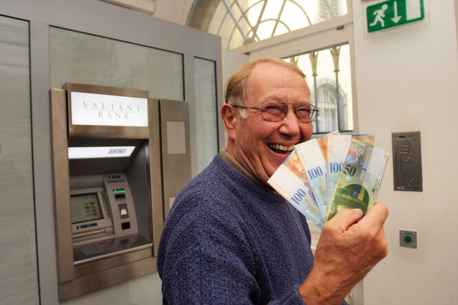 Guy with Euros at ATM