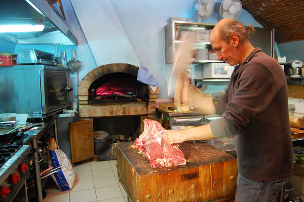 Giulio chopping steaks, Osteria dell’Acquacheta, Montepulciano, Italy