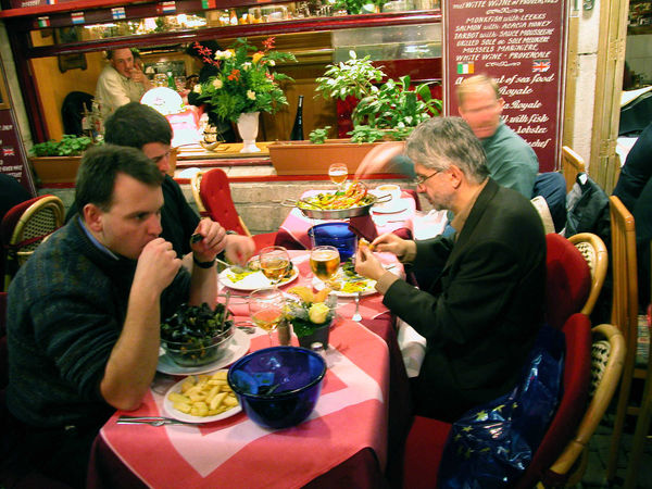 Dining on mussels on Rue des Bouchers, Brussels, Belgium