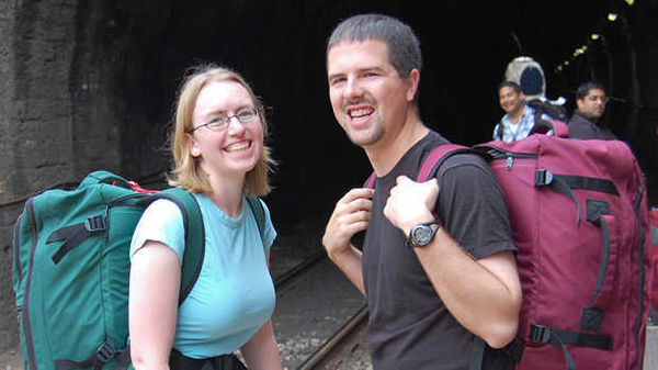 A couple wearing backpacks