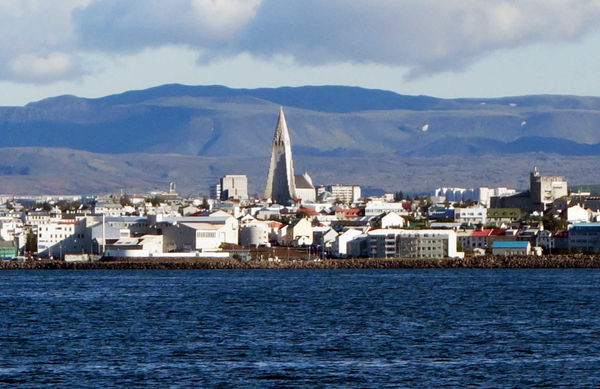 The skyline of Reykjavik, Iceland features Hallgrimskirkja, a towering Lutheran church