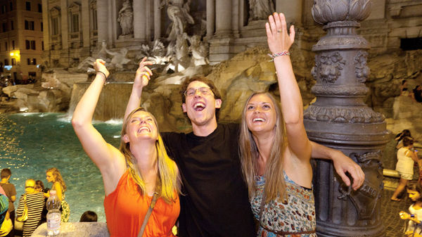 Coin tossing at Trevi Fountain, Rome, Italy