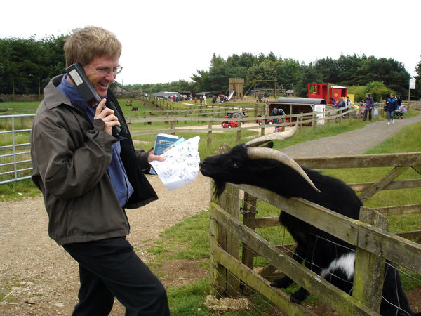 Rick with map-eating goat, Cotswold Farm Park, Cotswolds, England