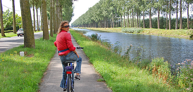 Canalside bike ride, Bruges, Belgium