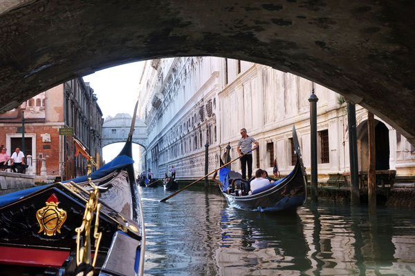 Riding a gondola toward the Bridge of Sighs, Venice, Italy