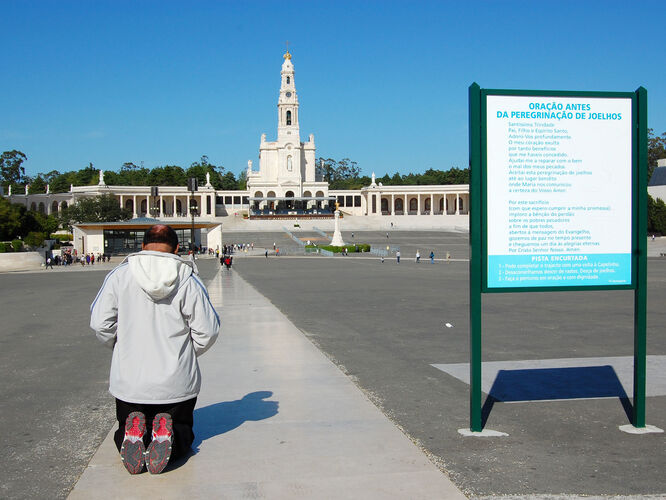 Pilgrim outside Basilica of Our Lady of Fátima, Portugal