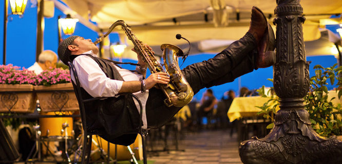 Restaurant musician on Piazza IX Aprile, Taormina, Sicily, Italy
