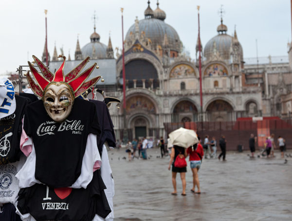 T-shirt stand on St. Mark's Square, with St. Mark's Basilica, Venice, Italy
