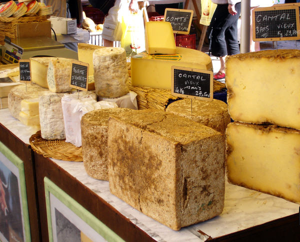 Cheese stand in market, Dordogne, France 