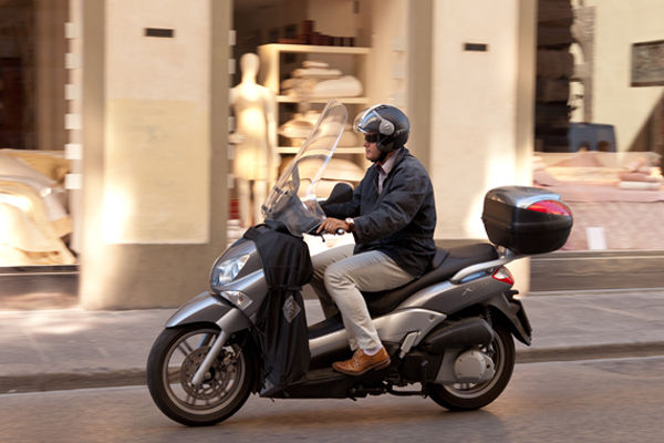 Vespa driver, Florence, Italy