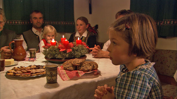 Cookies and prayer on Christmas Eve in Austria