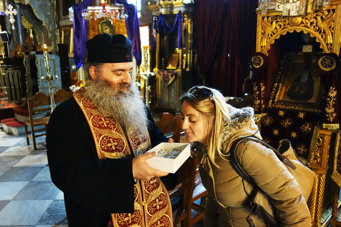 Inhaling incense, Nafplio, Greece