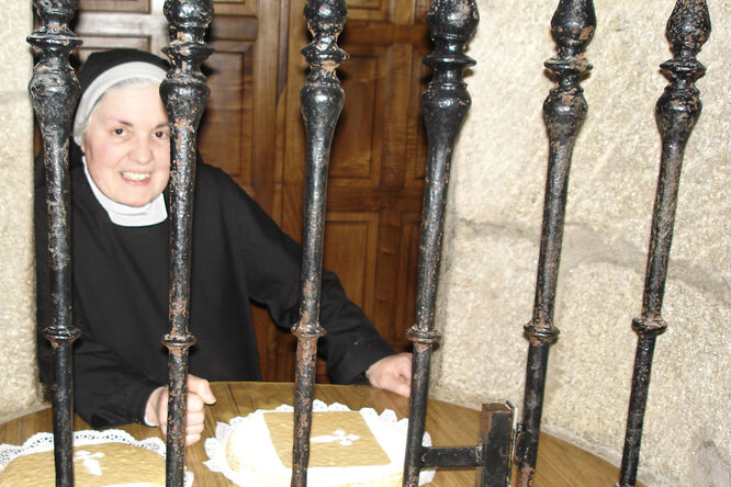 Nun selling convent-produced almond cakes, Santiago de Compostela, Spain