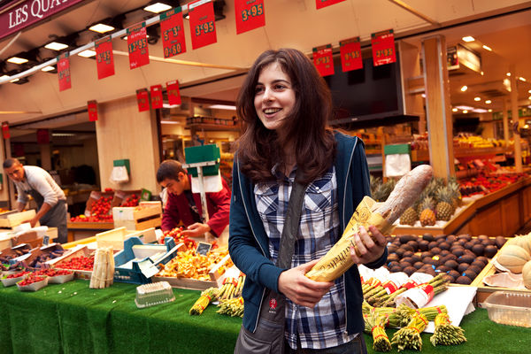 Guide leading a food tour in Paris, France