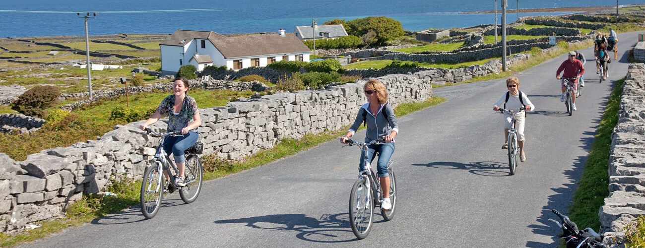 A group of cyclists in the Aran Islands, Ireland