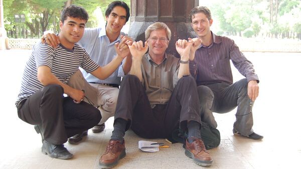 Rick and friends hooking fingers, Iran