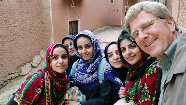 Rick taking a selfie with colorfully dressed girls, Iran