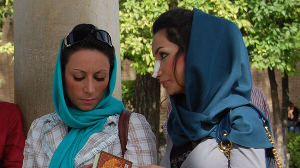 Lady with gauze on her nose, Iran