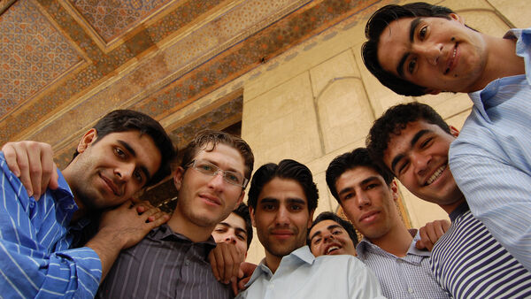 Locals gathered around the camera, Iran