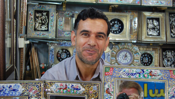 A smiling shopkeeper, Iran