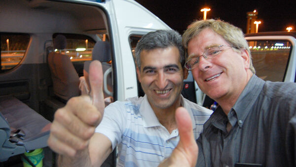 Rick and his driver celebrating with a thumbs up, Iran