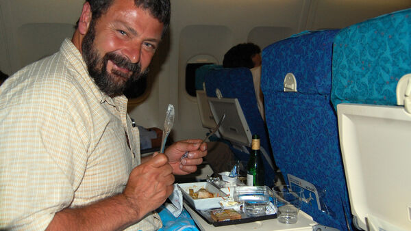 Rick's producer, Simon, enjoying a in-flight meal