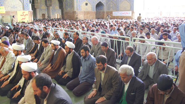 Crowds praying upright, Iran