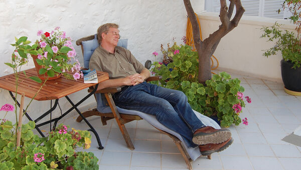 Rick Steves taking a nap in Hydra, Greece