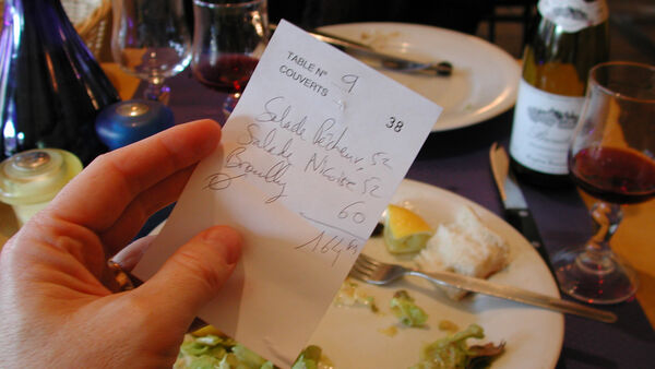 Handwritten receipt in Paris restaurant