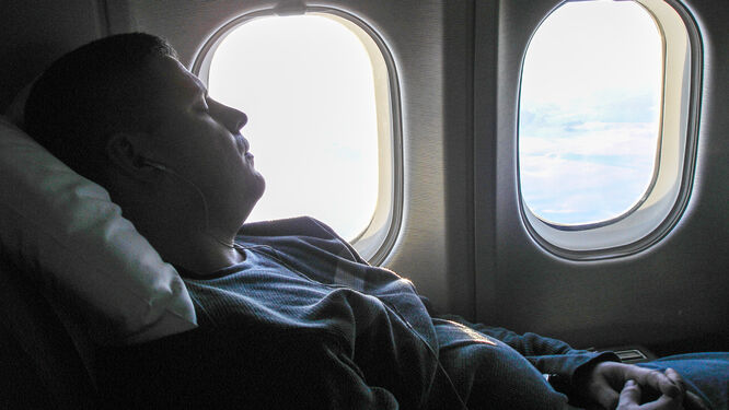 Airplane passenger sleeping