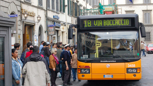Crowded bus stop in central Florence