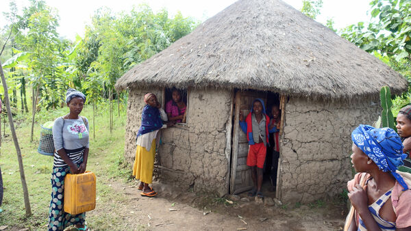 People gathered at a village hut in Ethiopia