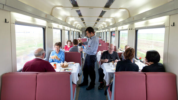 Passengers in dining car on train