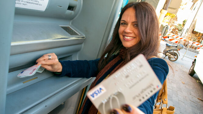 Woman getting cash at ATM