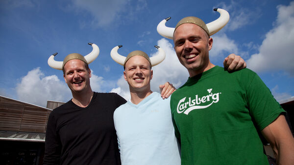 Men wearing costume Viking hats