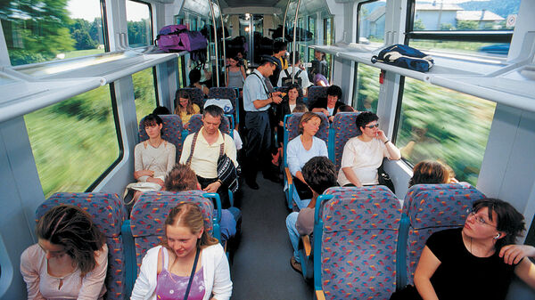 Passengers in second class car on train