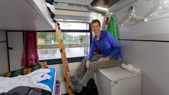 Woman in sleeping compartment on train