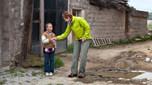 Woman shaking hand with boy, Cappadocia, Turkey