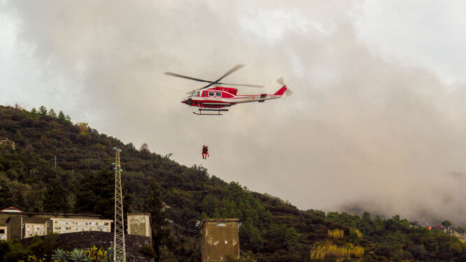 Helicopter lifting people