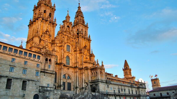 The facade of the Cathedral of Santiago de Compostela, Spain, bathed in late-afternoon light