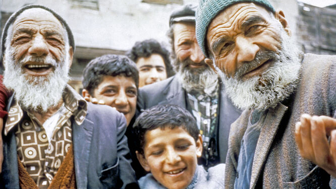 Six friendly males of varying ages crowd the camera in a village in eastern Turkey