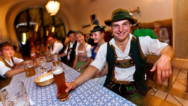 Lederhosen- and dirndl-bedecked beer drinkers in Munich's legendary Hofbräuhaus beer hall