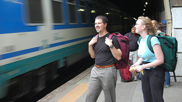 Backpackers at a train station
