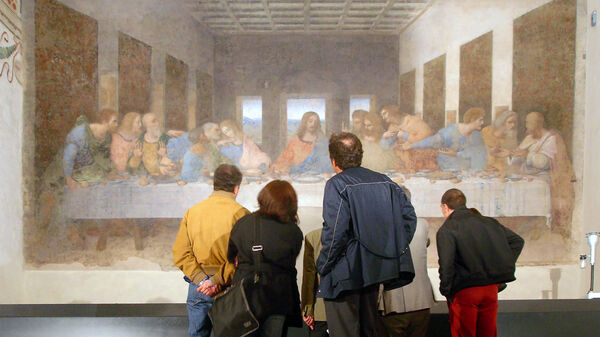 Visitors take in Leonardo da Vinci's "Last Supper," painted on the walls of Milan's Church of Santa Maria delle Grazie