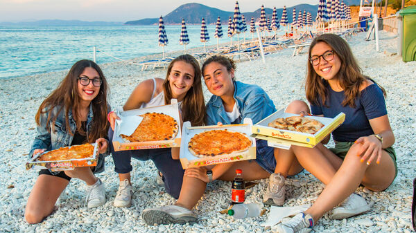 Eating pizza at the beach