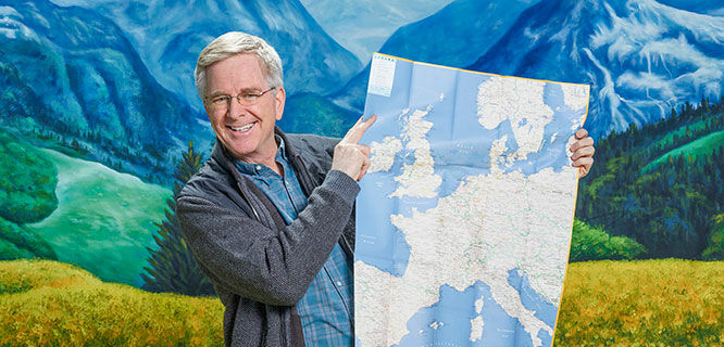 Rick Steves with map in the Alps
