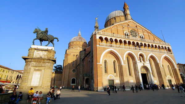 The facade of the Basilica of St. Anthony, and Donatello's bronze "Equestrian Statue of Gattamelata," on Piazza del Santo in Padua/Padova, Italy