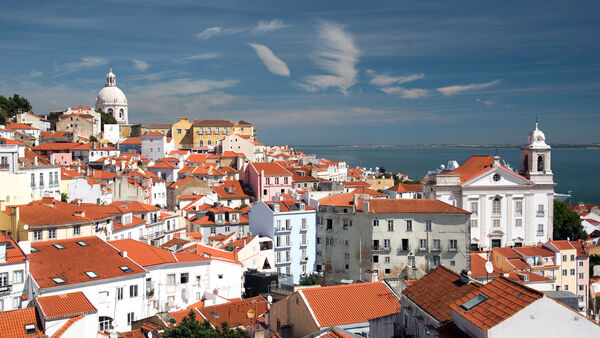 The red-roofed, whitewashed houses of Lisbon's hilly Alfama district, Portugal